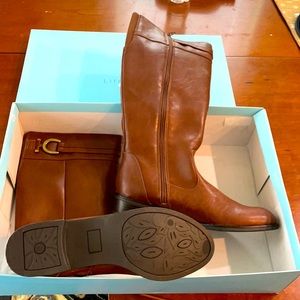 Ladies boots,never worn. Brown.Full length zipper on inside calf area. Size 10 M